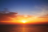 Fototapeta Zachód słońca - Beautiful cloudscape over the sea, sunset shot