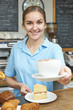 © highwaystarz - Waitress In Cafe Serving Customer With Coffee