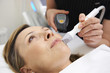 © highwaystarz - Beautician Carrying Out Ultrasound Skin Rejuvenation Treatment