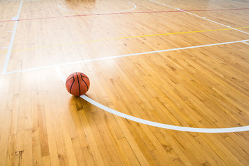 Poster - Basketball ball over floor in the gym