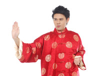Chinese Young Man With Tradition Clothing Practicing Tai Chi