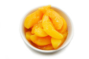 Wall Mural - Top View Of Sliced Peaches in a White Bowl