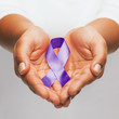 © Syda Productions - hands holding purple awareness ribbon