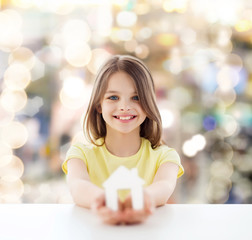 Canvas Print - beautiful little girl holding paper house cutout