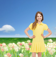 Wall Mural - smiling little girl in yellow dress