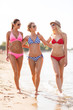 © Syda Productions - group of smiling young women on beach