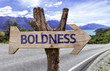 Boldness wooden sign with a street background