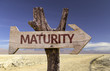Maturity wooden sign with a desert background