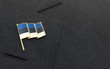 Estonia flag lapel pin on the collar of a business suit