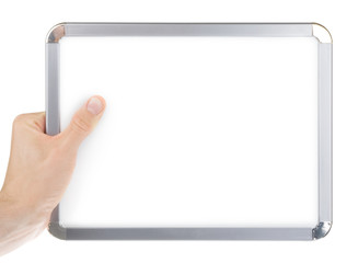 Wall Mural - Hand holding an empty whiteboard (magnetic board) isolated
