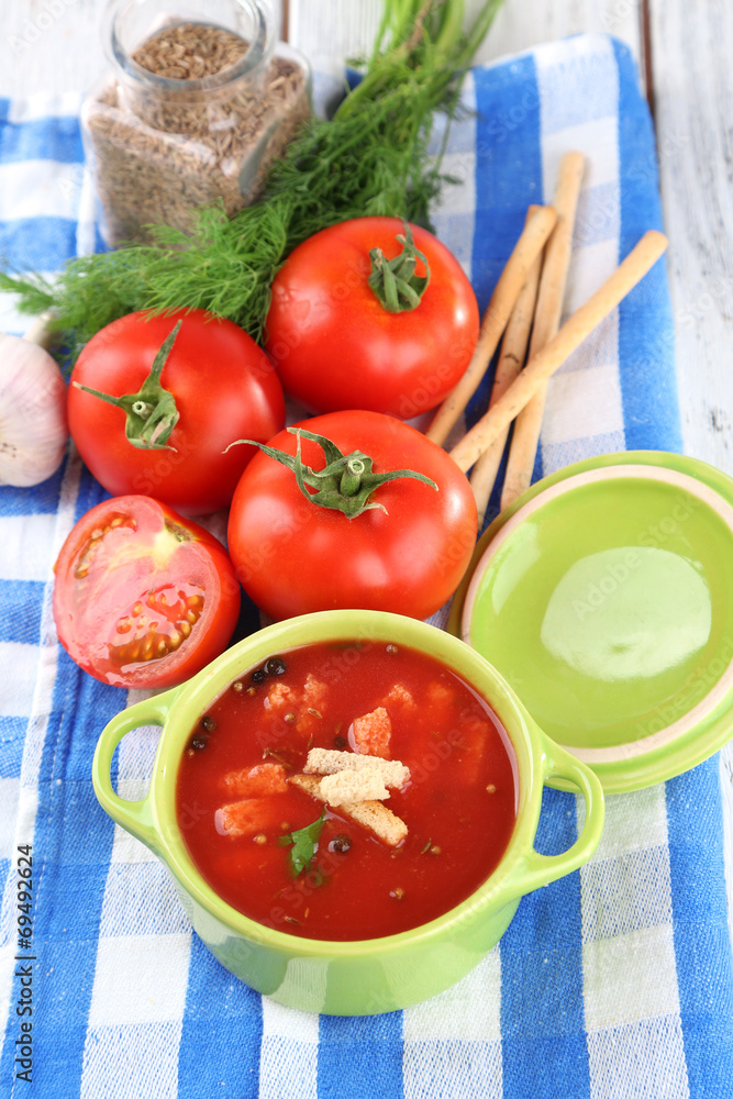 Tasty tomato soup with croutons on table close-up