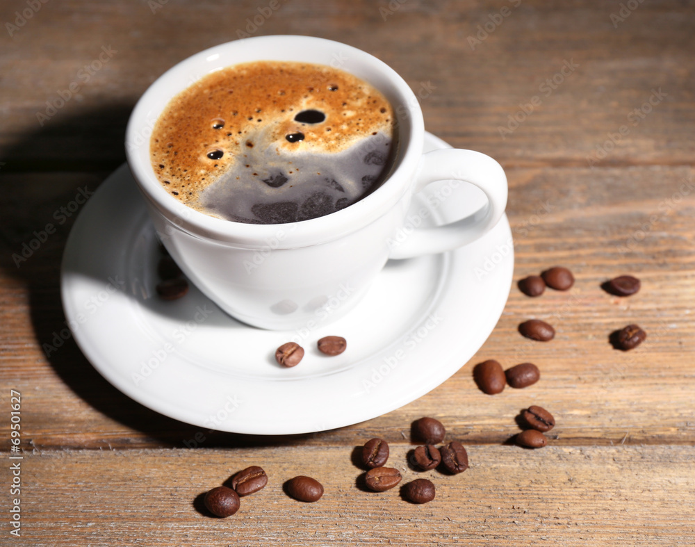 Cup of coffee on wooden background