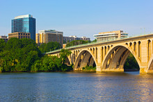 Key Bridge In Washington DC With Office Building On Background
