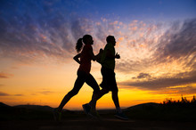 Silhouette Of Couple Running