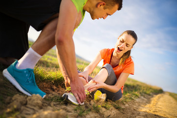 Female runner with twisted ankle