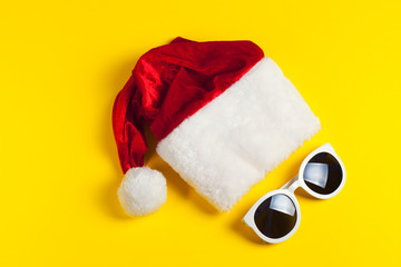 Wall Mural - Stylish white sunglasses with red hat santa claus