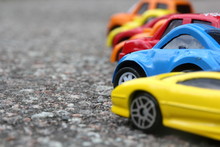 Miniature Colorful Cars Standing In Line On Road Sale Concept