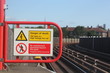 electric shock hazard no entry sign rail train station