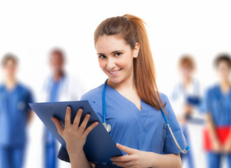 Wall Mural - Doctor in front of her medical team