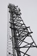 Telecommunication tower with antennas in the mist