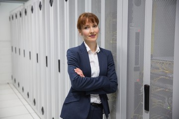 Poster - Pretty computer technician looking at camera