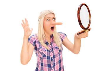 Sticker - Shocked woman looking at her long nose in a mirror