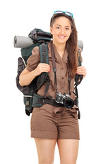 Poster - Vertical shot of woman carrying hiking equipment