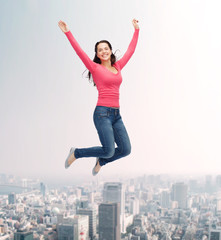 Sticker - smiling young woman jumping in air