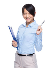 Wall Mural - Businesswoman with clipboard and pen up