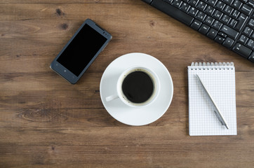 Black  keyboard, smart phone and office supplies