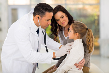 Wall Mural - medical doctor examining a little girl