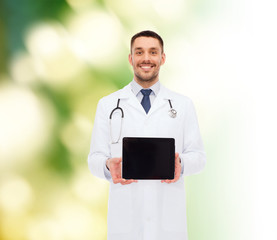 Wall Mural - smiling male doctor with tablet pc