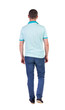 © ghoststone - Back view of going  handsome man in jeans and a shirt.