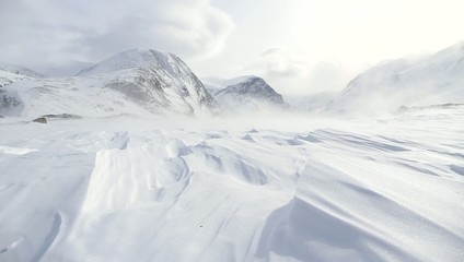 snow and wind in the arctic mountains