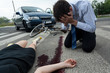 © Photographee.eu - Driver and injured woman at road accident scene
