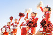 © Mirko Vitali - Group of cheerleaders in action with male coach - Team sport