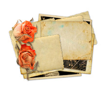 Pile Of Old Photos And Letters With Bouquet Of Dried Roses On Wh