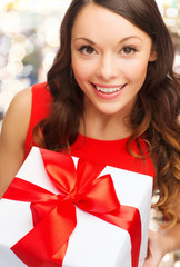 Poster - close up of smiling woman with gift box