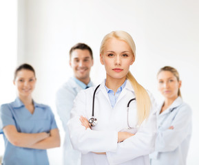 Canvas Print - serious female doctor with stethoscope