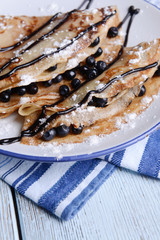 Wall Mural - Delicious pancakes with blueberries on table close-up