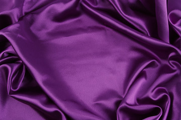 Wall Mural - Rippled purple silk fabric texture background