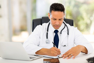 Wall Mural - male medical doctor writing reports