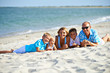 © Valua Vitaly - Mother and father with three children on the beach.