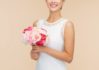 Wall Mural - smiling woman in white dress with bouquet of roses