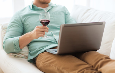 Poster - close up of man with laptop and wine glass