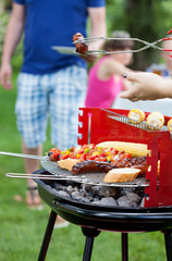 Canvas Print - Friends during grilling in garden