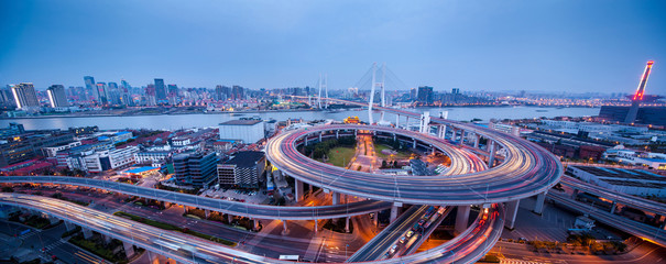 night view of the bridge and city in shanghai china.