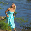 © ruslimonchyk - Mature  blonde in a white dress walks on the sandy road