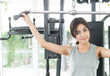 © siraphol - Woman workout at fitness