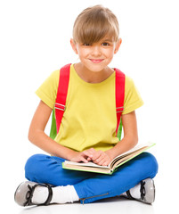 Fototapete - Portrait of a cute little schoolgirl with backpack